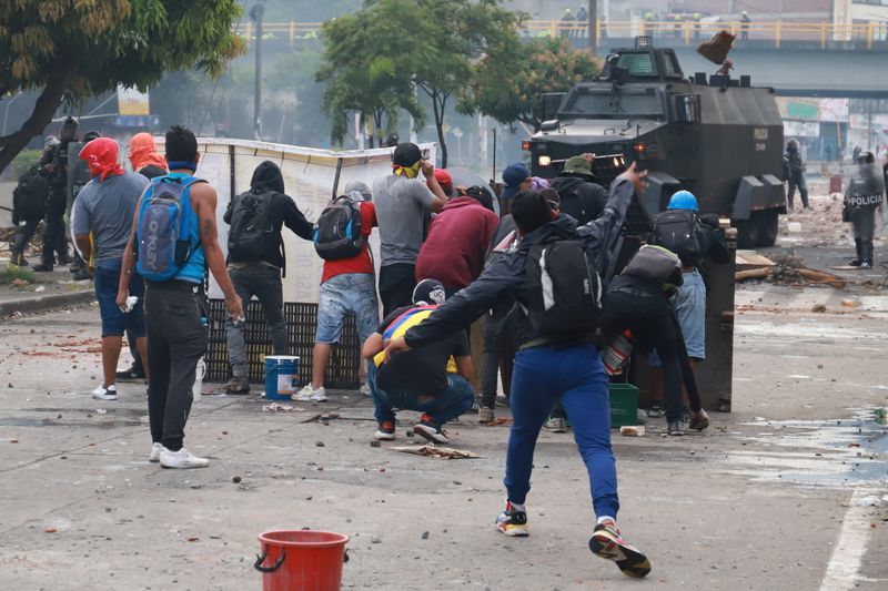 Demonstrators clash with members of the security forces during a