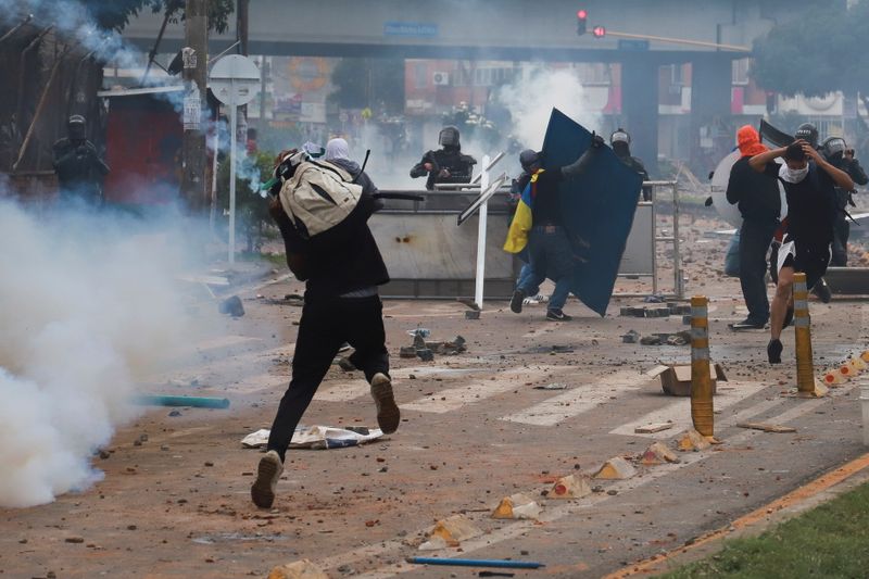 FILE PHOTO: Demonstrators clash with members of the security forces