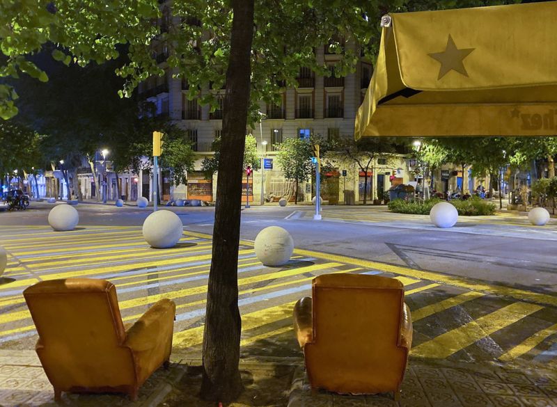 Sofas are seen on a street after curfew, in Barcelona