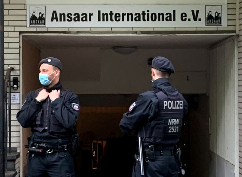 Police secures a building after Germany banned the Islamic organisation