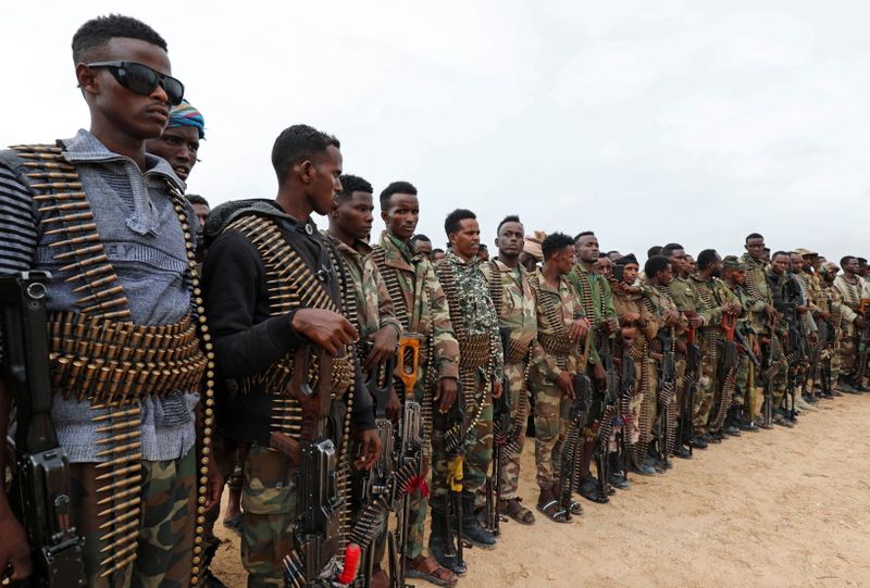 Somali military opposition soldiers from Hawiye clan parade as they
