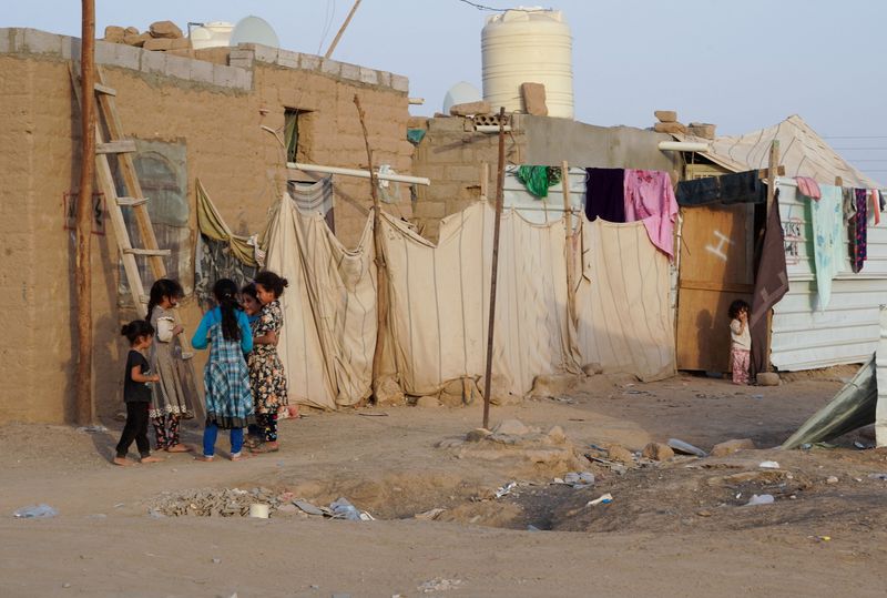 Girls play at a makeshift camp for internally displaced people