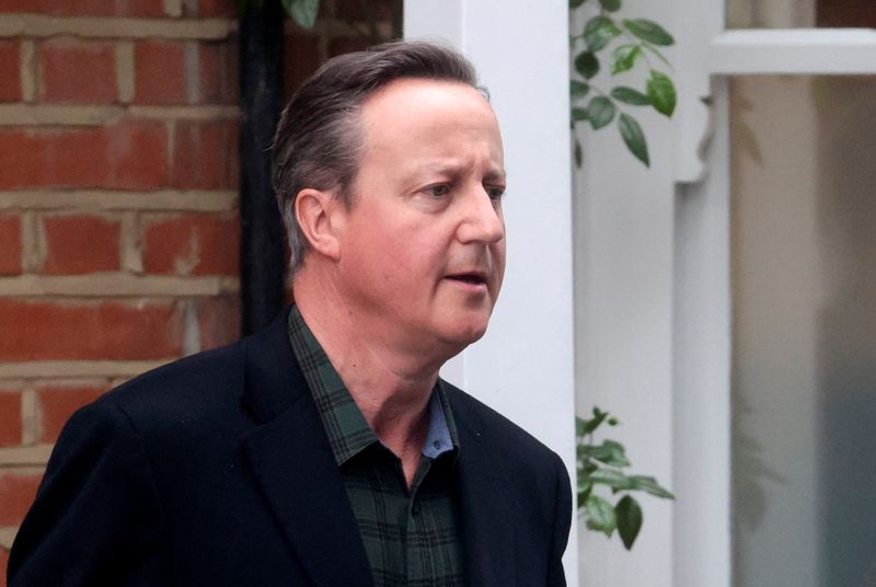 Former British Prime Minister David Cameron leaves his home in