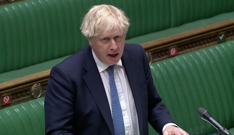 Britain’s PM Johnson speaks in Parliament in London