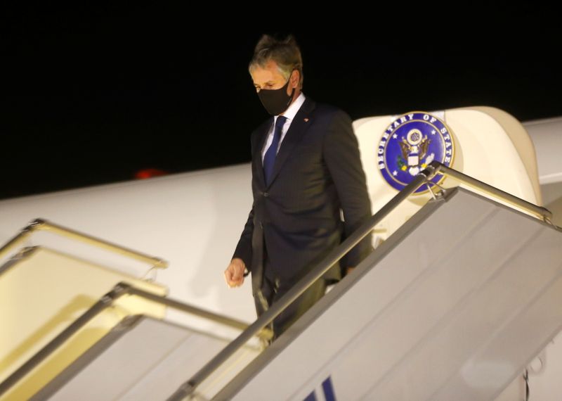 U.S. Secretary of State Antony Blinken disembarks after landing at