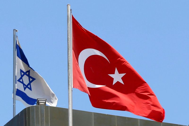 A Turkish flag flutters atop the Turkish embassy as an