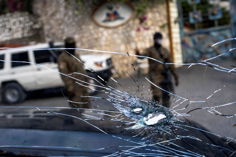 Bullet holes in the window of a presidential security car