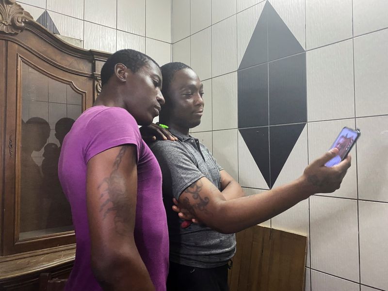 Transgender women Patricia and Shakiro record a video after their