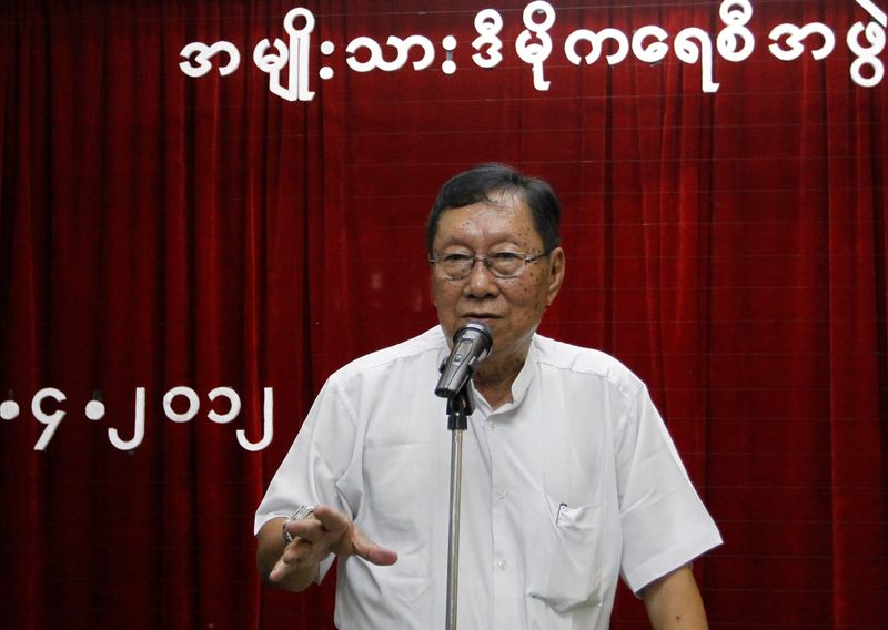 Top NLD official Nyan Win talks to reporters after a