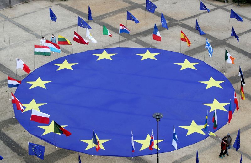 FILE PHOTO: EU flag lies at Schuman square in Brussels