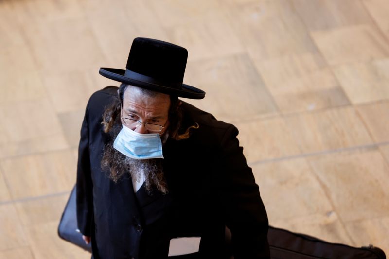 FILE PHOTO: An ultra-Orthodox Jewish man wearing a face mask,