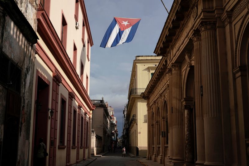 FILE PHOTO: A Cuban flag flies over a street in