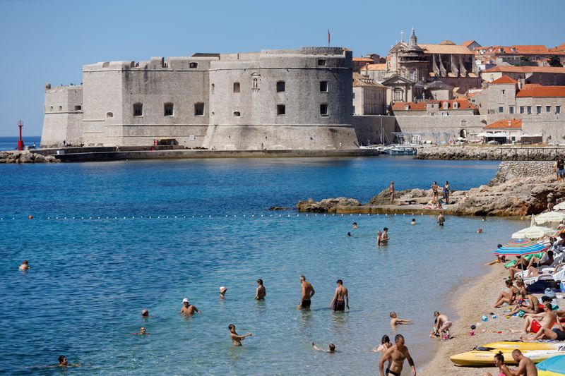 FILE PHOTO: People are seen at Banje beach in Dubrovnik