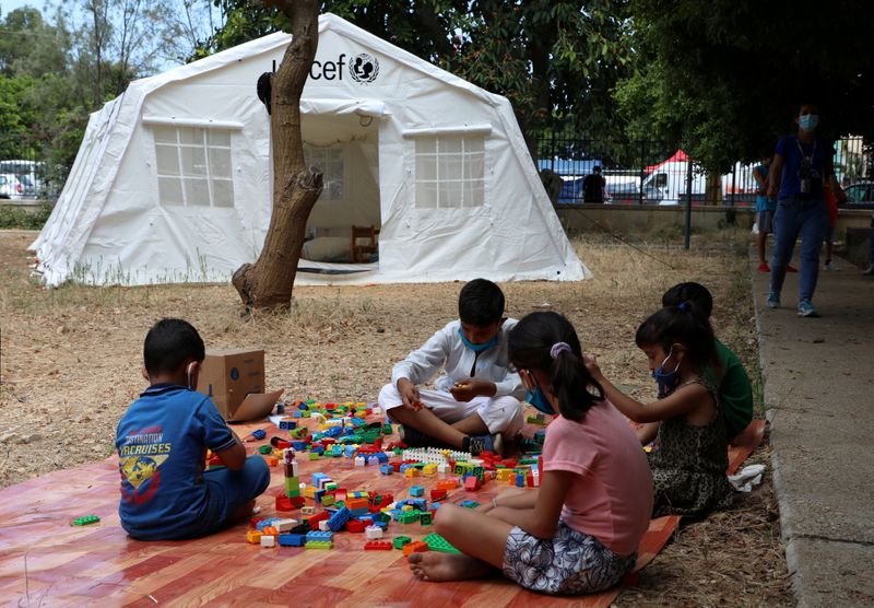FILE PHOTO: Children play outisde a UNICEF tent in Beirut