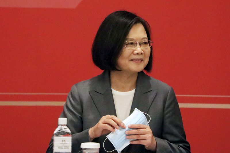 FILE PHOTO: Taiwan President Tsai Ing-wen holds her face mask