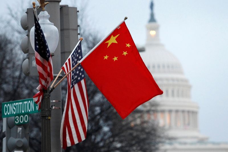 FILE PHOTO: The People’s Republic of China flag and the