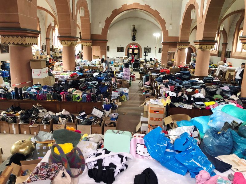 Donations for flood victims lie in the church of St.