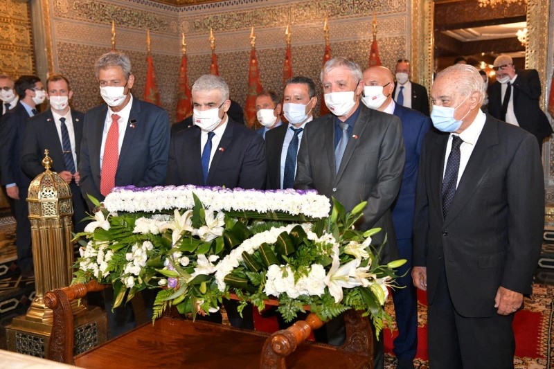 Israeli Foreign Minister Yair Lapid pays his respects at the