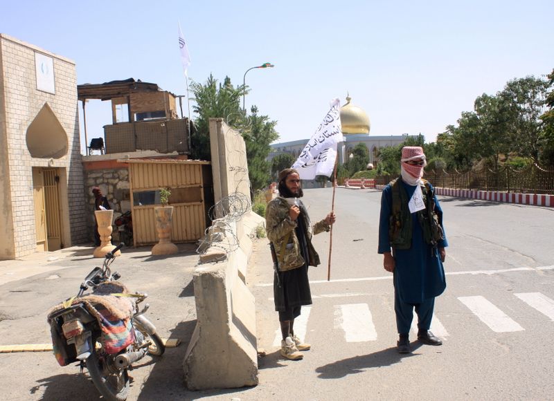 Taliban fighters keep watch in Ghazni province