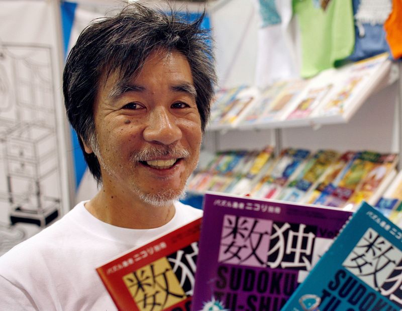 FILE PHOTO: ‘Father of Sudoku’ Maki Kaji holds copies of