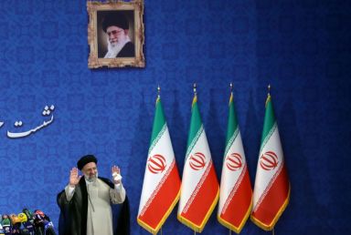 Iran’s President-elect Ebrahim Raisi gestures at a news conference in