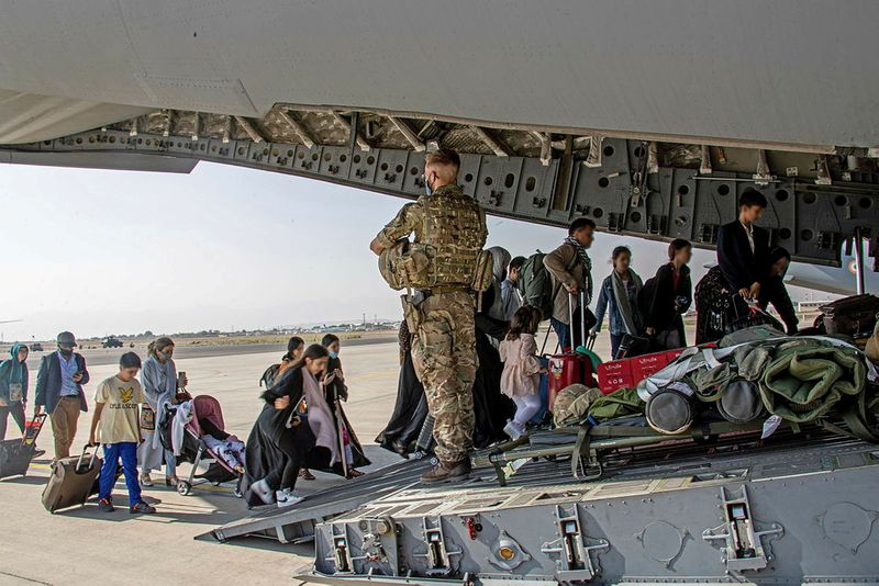 British citizens and dual nationals residing in Afghanistan board a