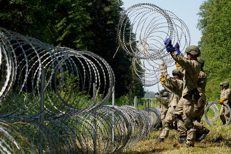 FILE PHOTO: Lithuania toughens Belarus border with razor wire to
