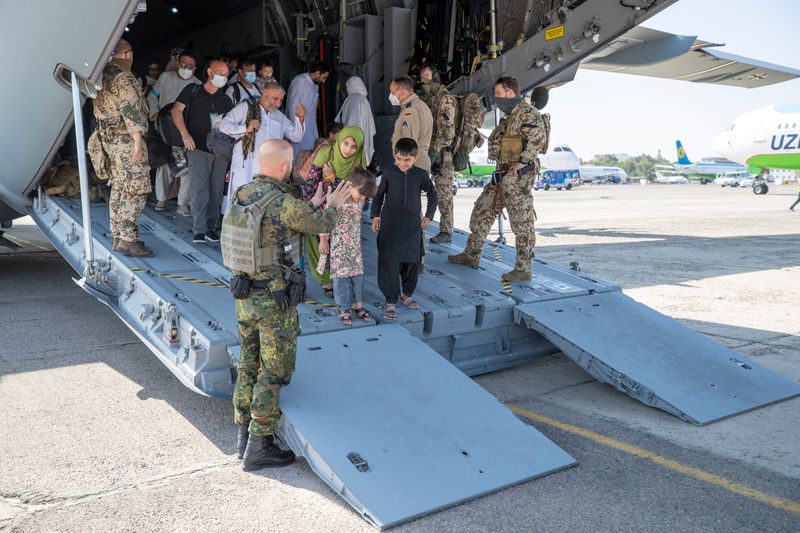 Evacuees from Afghanistan arrive in an Airbus A400 transport aircraft