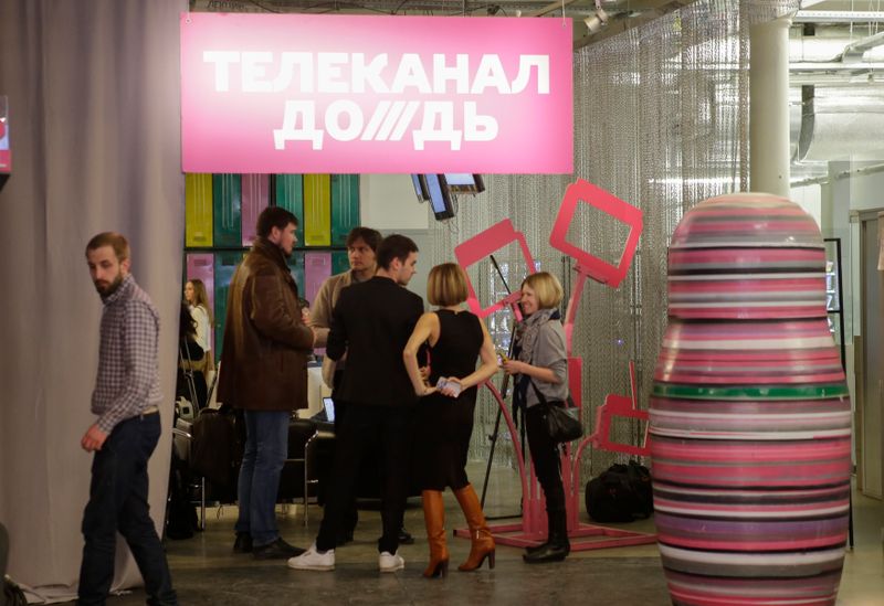 FILE PHOTO: Journalists chat in the offices of independent Russian