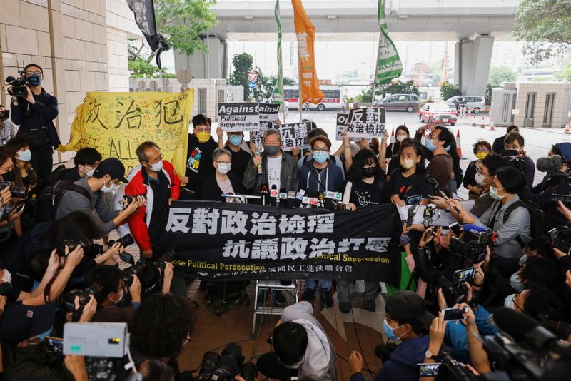 Pro-democracy activist Lee Cheuk-yan speaks to media as he arrives