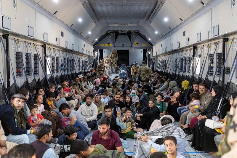 Evacuees from Afghanistan inside an Airbus A400 transport aircraft of