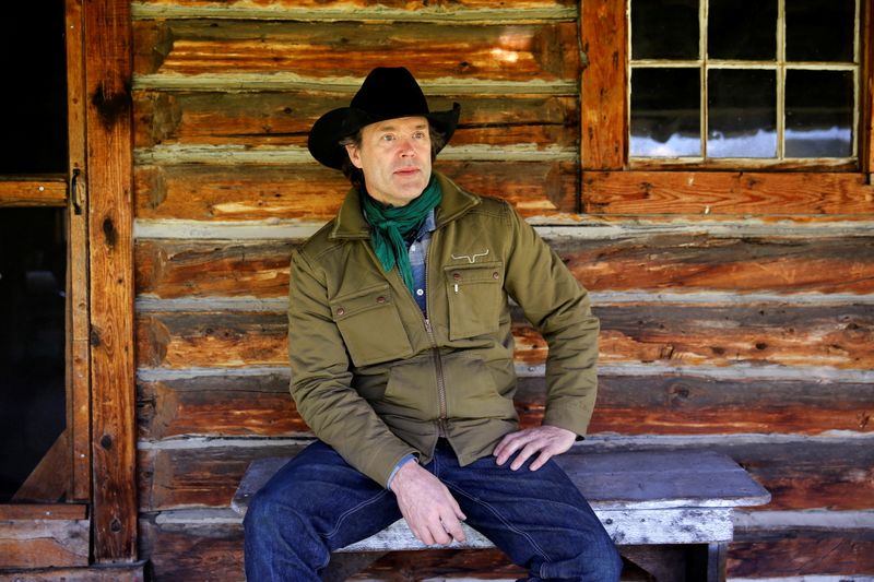 Singer songwriter Lund sits at a cabin on the site
