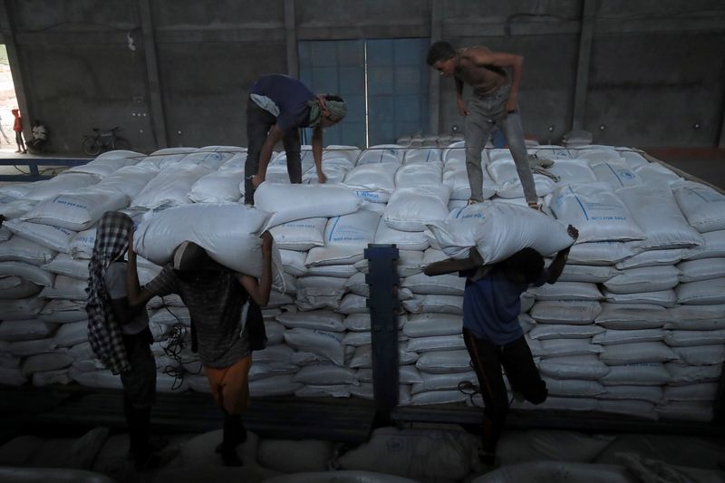 FILE PHOTO: Ethiopian porters unload food aid bound for victims
