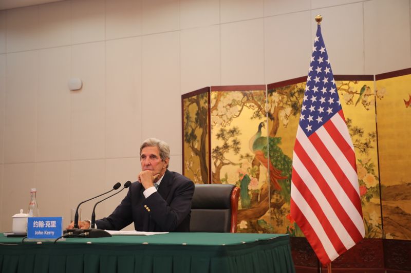John Kerry attends a meeting via video link with Yang