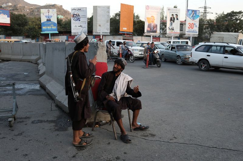 Two Taliban soldiers are pictured in Kabul