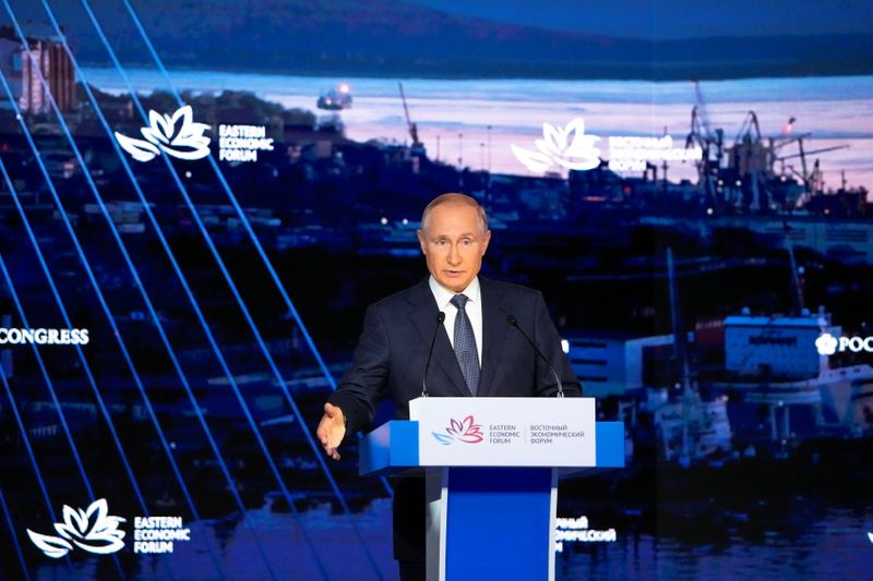 Russian President Vladimir Putin speaks at an economic forum in