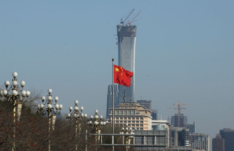 A Chinese flag flutters at Xinhuamen Gate of Zhongnanhai leadership