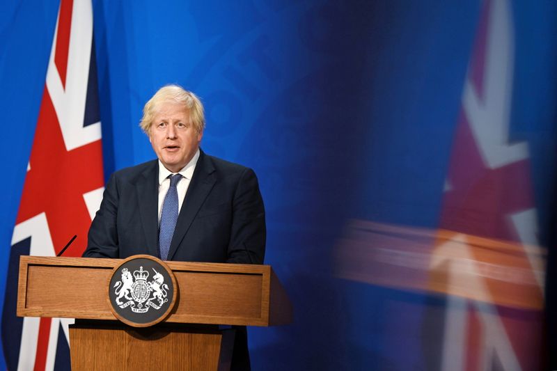 FILE PHOTO: Britain’s Prime Minister Boris Johnson holds a news