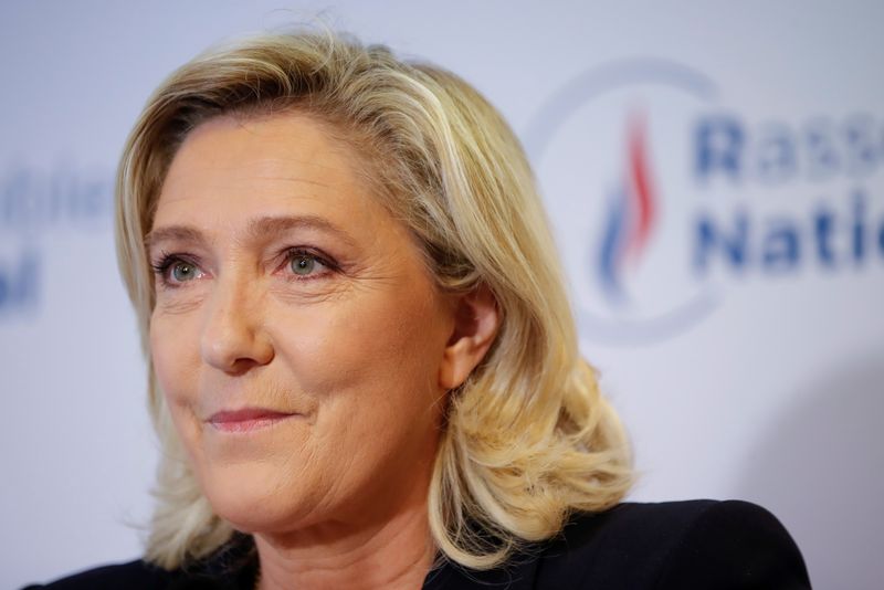French far right leader Marine Le Pen reacts to the