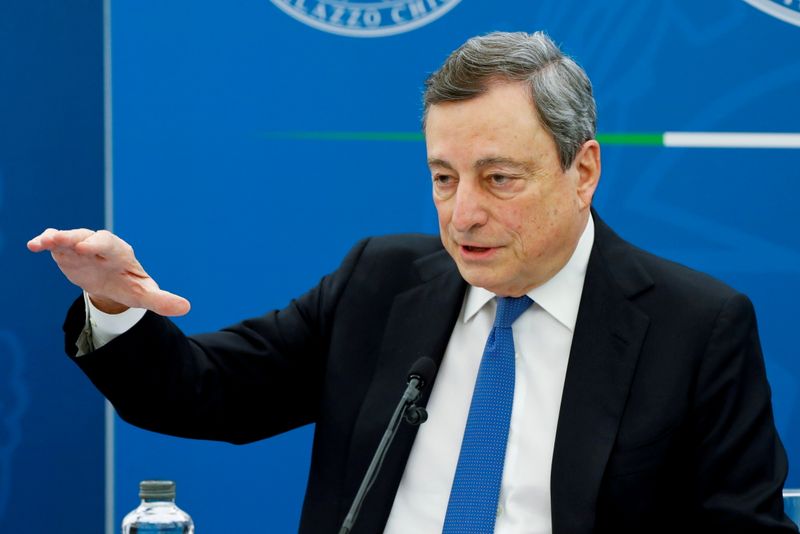 FILE PHOTO: Italy’s Prime Minister Mario Draghi gestures as he