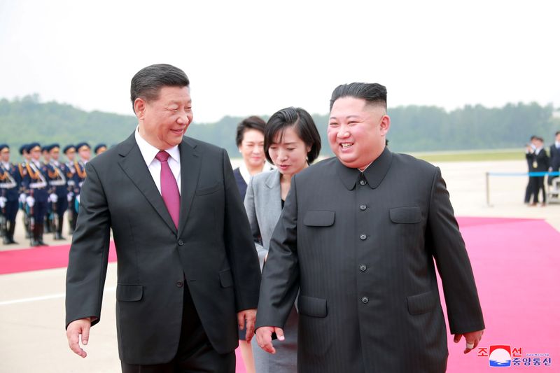 North Korean leader Kim Jong Un welcomes Chinese President Xi