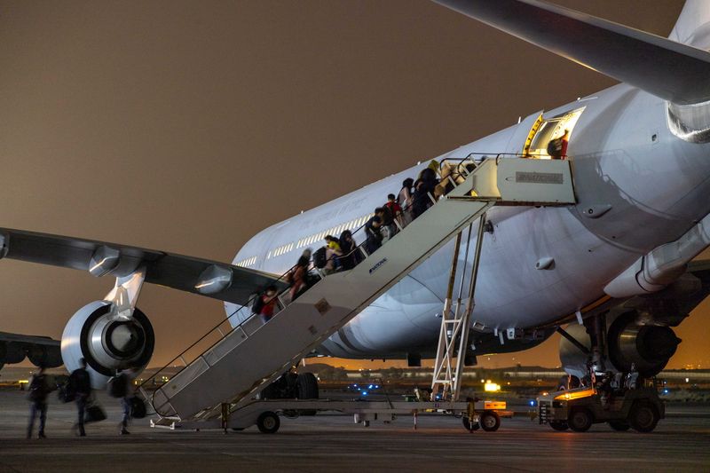 Evacuees from Afghanistan board a Royal Australian Air Force KC-30