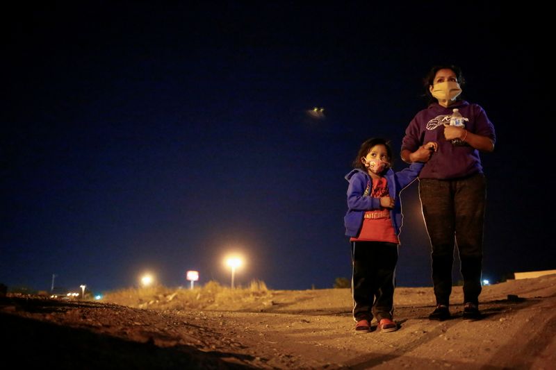An asylum-seeking migrant from Honduras and her daughter are seen