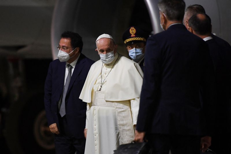 Pope Francis arrives to board the plane for his visit