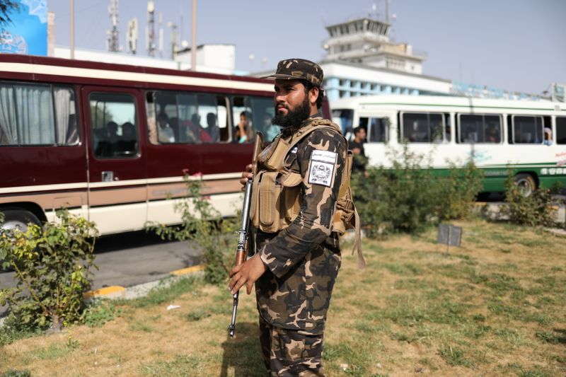 A member of Taliban security forces stands guard at the