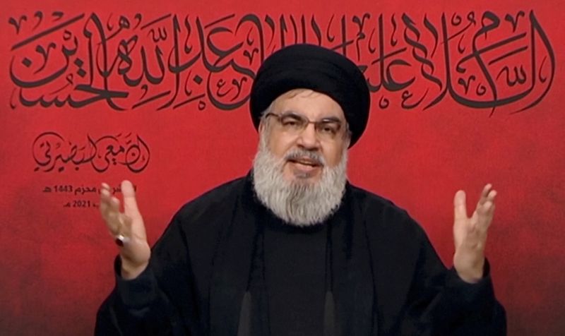 Lebanon’s Hezbollah leader Sayyed Hassan Nasrallah speaks through a screen