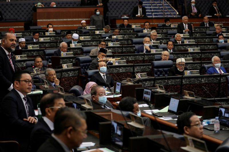 FILE PHOTO: Malaysia’s members of parliament attend a session of
