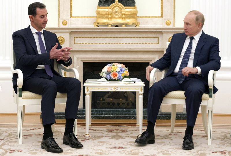Russian President Vladimir Putin meets with Syrian President Bashar al-Assad