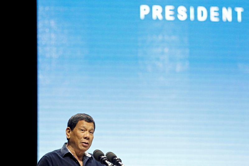 FILE PHOTO: Philippines President Rodrigo Duterte addresses the resident Filipino