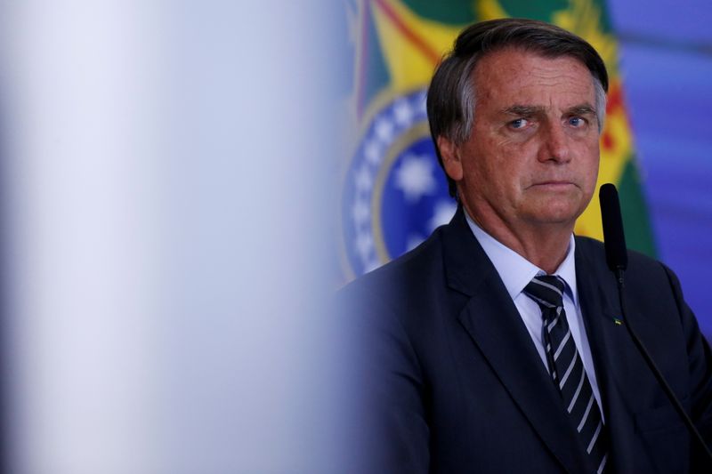 Brazil’s President Bolsonaro looks on during a ceremony in Brasilia
